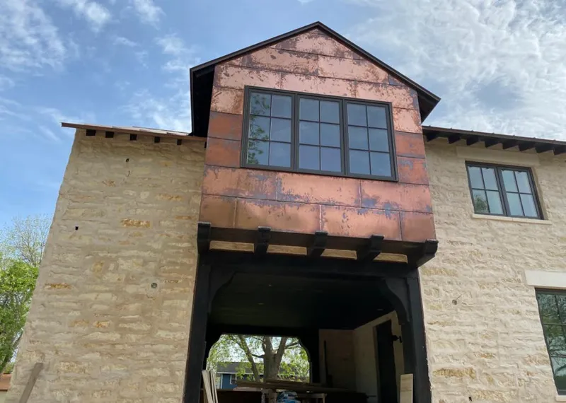 Copper metal panel facade on a stone building for Skylight Installation in Cheverly
